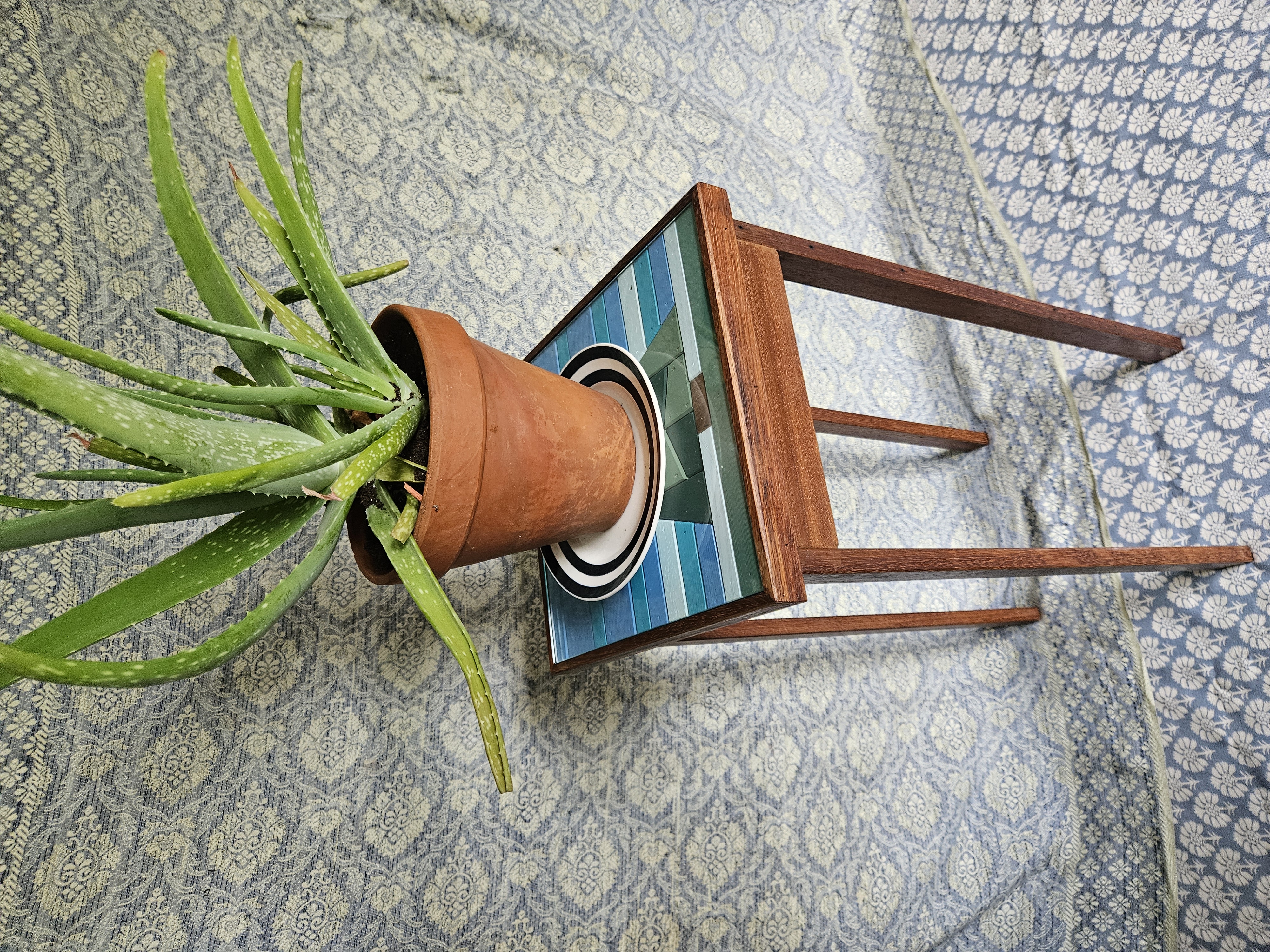 Glass topped plant table made from reclaimed wood